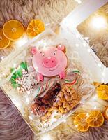 Gift box with candies, cookies and candies on fur background photo
