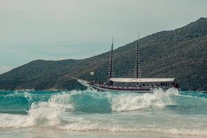 Boat in the sea on the background of mountains and sky. photo