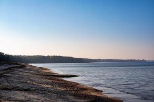 Sunset on the coast of the Baltic Sea. Summer landscape. photo