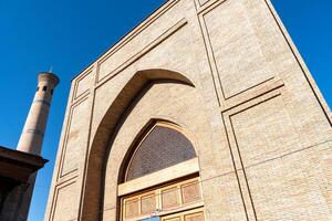 Tashkent, Uzbekistan-august 11, 2023-view of the entrance of the Tillya Sheikh Mosque  during a sunny day.The complex is a square that includes a set of religious buildings in Tashkent photo