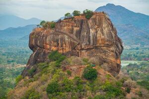 Scenery view of Sigiriya rock an iconic tourist destination and one of UNESCO world heritage site in Sri Lanka. photo