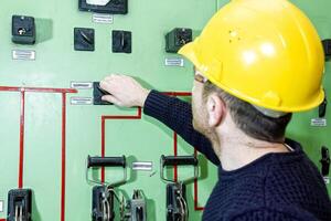 industrial worker at the work in factory photo