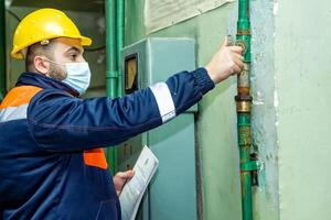 industrial worker at the work in factory photo