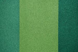 Green glitter paper of different shades photo