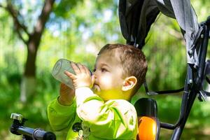 child playing in the garden, child playing on the playground photo