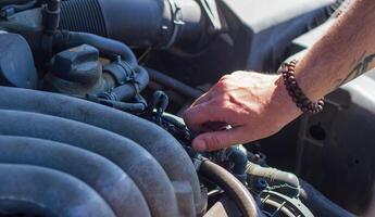 car mechanic fixing car engine, auto mechanic is repairing car engine photo