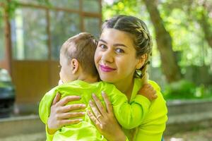 parent and child in the park, mother and baby boy in the park photo