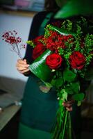 Woman Holding Bouquet of Red Roses photo