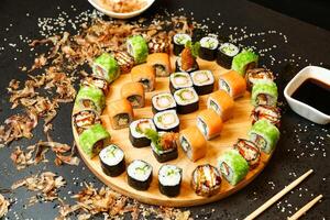 Plate of Sushi and Chopsticks on Table photo