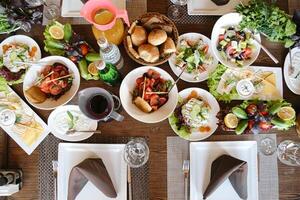 Abundant Display of Various Dishes on Table photo