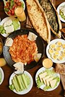 Wooden Dining Table Displaying Plates of Food photo