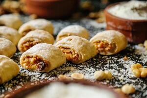 Table Topped With Powdered Sugar-Covered Pastries photo