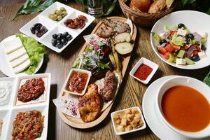 Wooden Table With Platters of Food photo