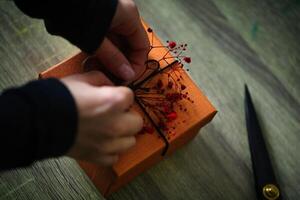 Person Cutting Paper With Scissors photo