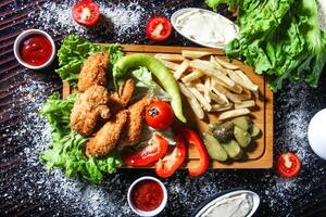 Abundant Wooden Cutting Board Covered in Assorted Food photo