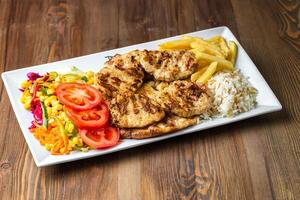 Chicken, Rice, and Veggie Plate With White Background photo