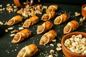 Abundant Table Spread With Various Foods and Nut Bowls photo