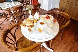 White Table With Plates of Food photo