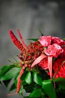 Red and Pink Flower Bouquet in Vase photo