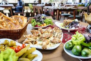 Abundant Spread of Various Dishes on Table photo