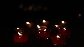 Christmas candles burning at night. Many burning candles with shallow depth of field. video