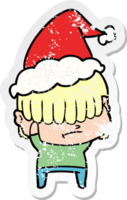 hand drawn distressed sticker cartoon of a boy with untidy hair wearing santa hat png