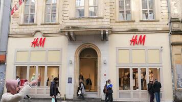 turkey istanbul 17 january 2024.Pedestrians passing by the HM stores window display at taqsim square video