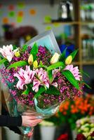 Person Holding Bouquet of Flowers photo