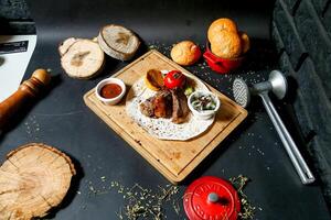 Wooden Cutting Board With Assorted Meat and Fresh Vegetables photo