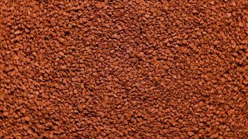 full frame spinning background of freeze-dried instant coffee granules - close-up view from above video