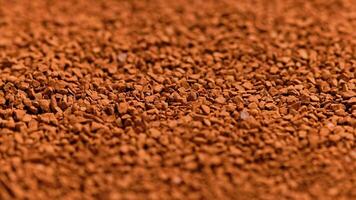 full frame slowly spinning background of freeze-dried instant coffee granules video