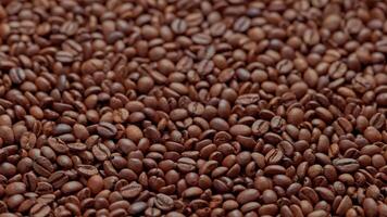 full frame looped spinning background of roasted coffee beans video