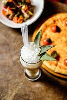 Table With Plate of Food and Drink photo