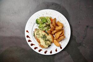 White Plate With Chicken, Fries, and Broccoli photo