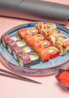 Plate of Sushi on Pink Table photo