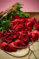 Red Roses on Table - Beautiful Floral Arrangement With Ample Copy Space photo