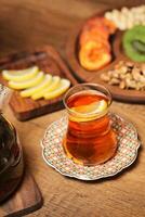 Pitcher of Tea on Wooden Table photo