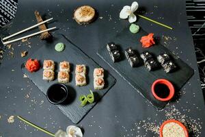 Sushi and Chopsticks Arranged on Table photo