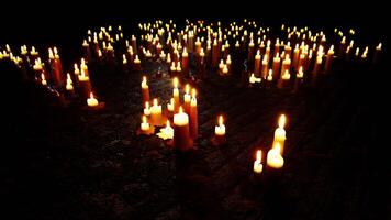 Illuminated Display of Numerous Candles in the Dark video