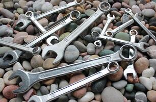Ring End And Open End Wrenches On A Pebbles Angle View photo