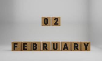 wooden cubes with arranged letters. February and 02 on blurry white background photo