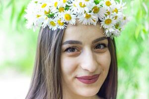 portrait of a woman with white flowers, portrait of a woman in the park photo