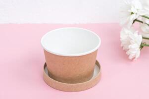 Eco-Friendly Cup on Pink Background photo