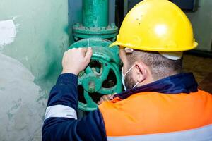 industrial worker at the work in factory photo