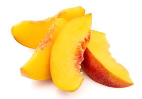 Peach slices on white backgrounds photo