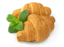 Fresh croissants with mint photo