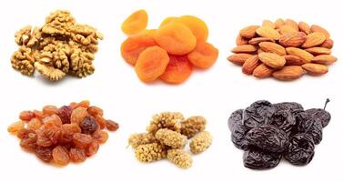 Dried nuts and fruits on white backgrounds photo