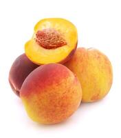 Ripe peaches on white backgrounds photo