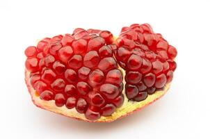 Pomegranate on white backgrounds photo