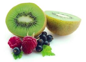 kiwi with berries on white backgrounds photo